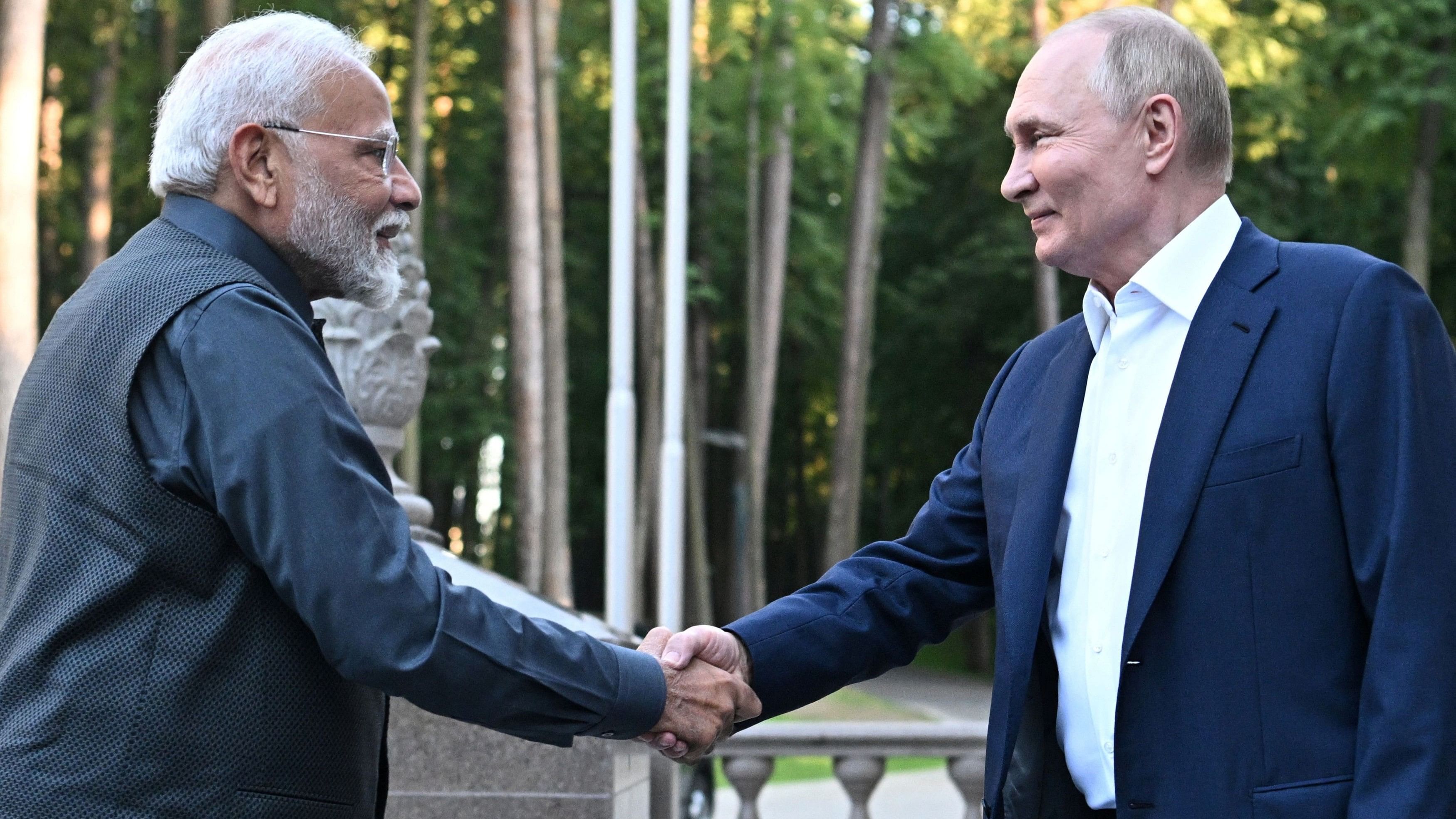 <div class="paragraphs"><p>Narendra Modi shakes hand with&nbsp;Vladimir Putin.</p></div>